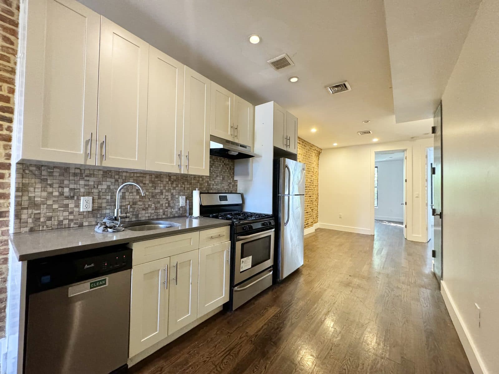 Kitchen with white cabinets and stainless steel appliances