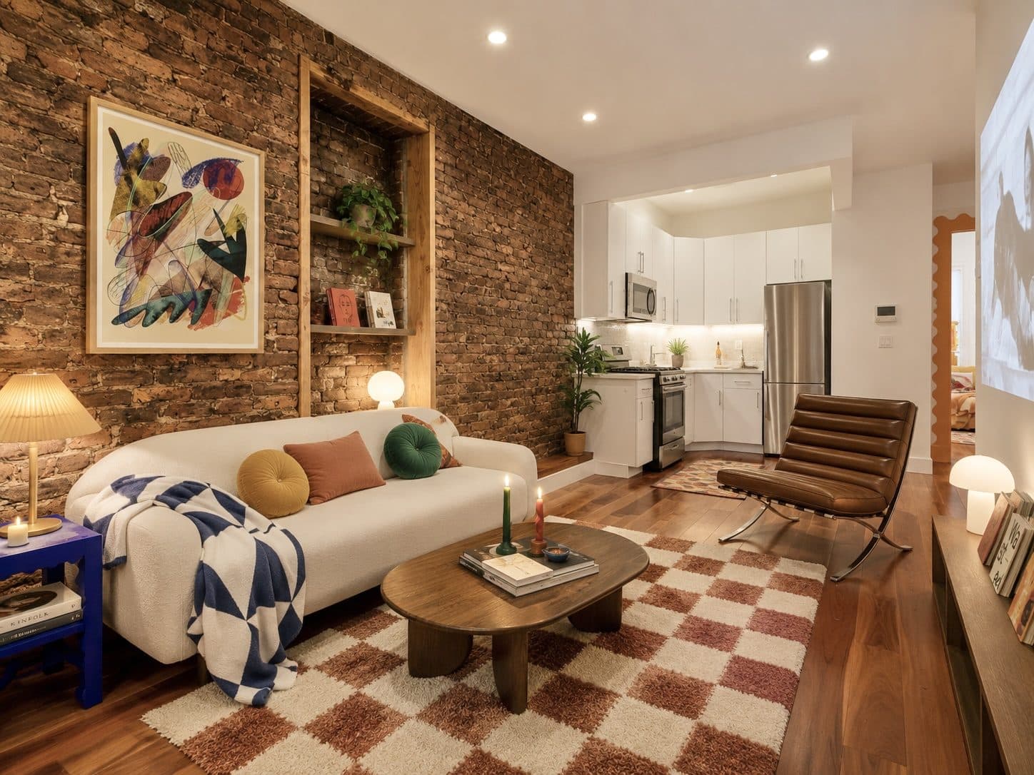Living room with an exposed brick wall and an open kitchen, virtually staged