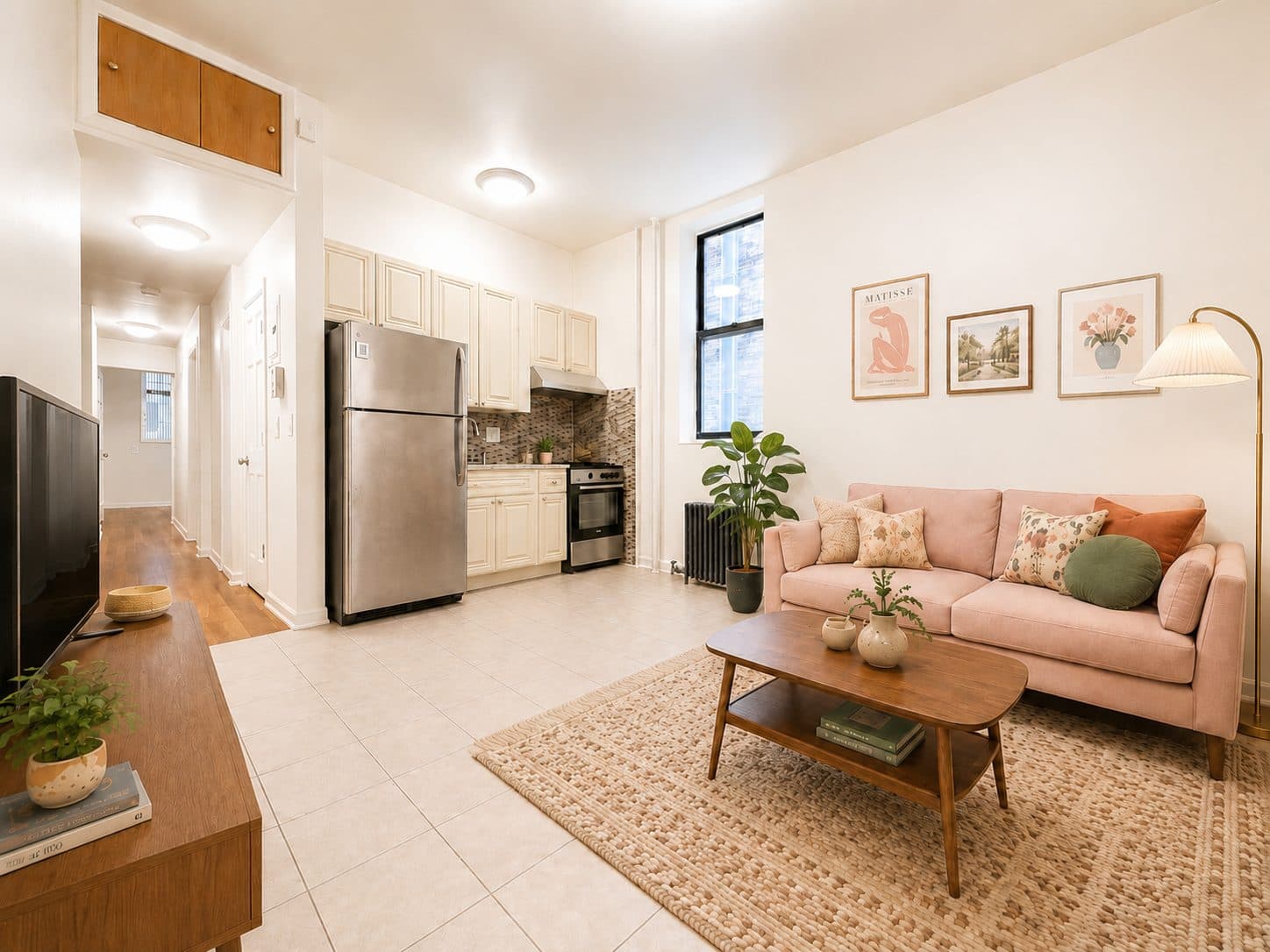 Living room with an open kitchen and radiator, virtually staged