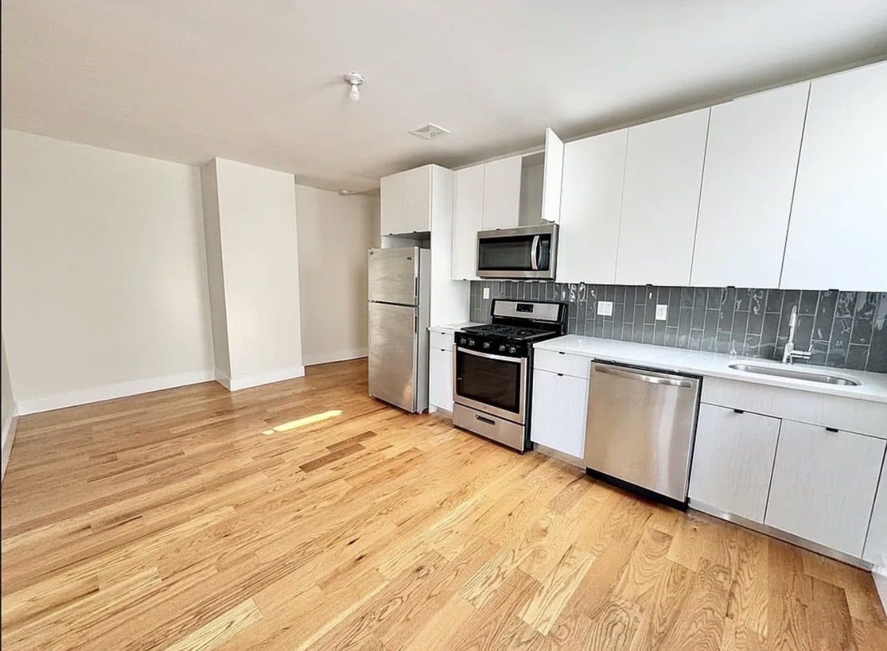 Kitchen with white cabinets and stainless steel appliances