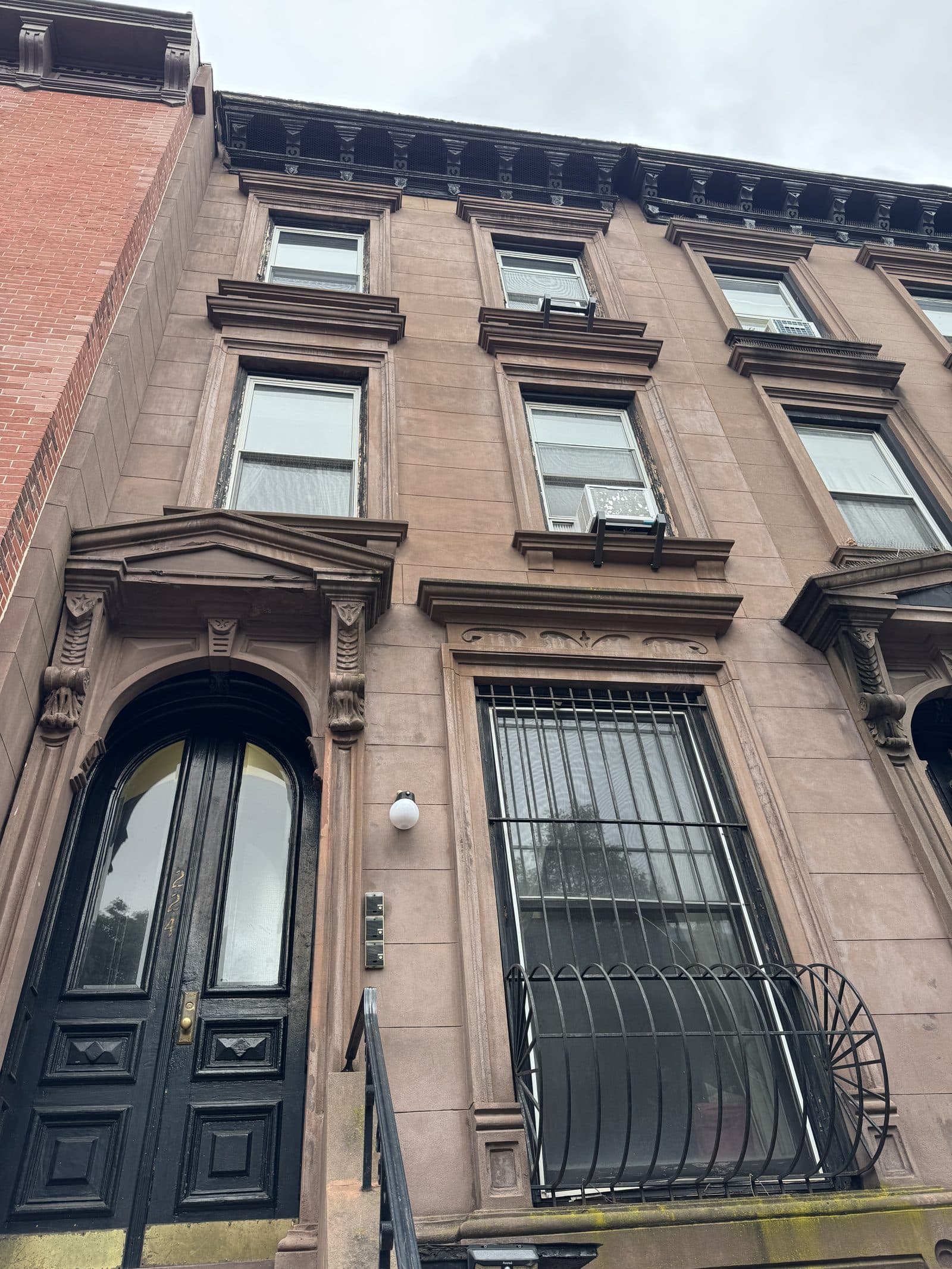 Brownstone entrance with carved stone doorway in Fort Greene, Brooklyn