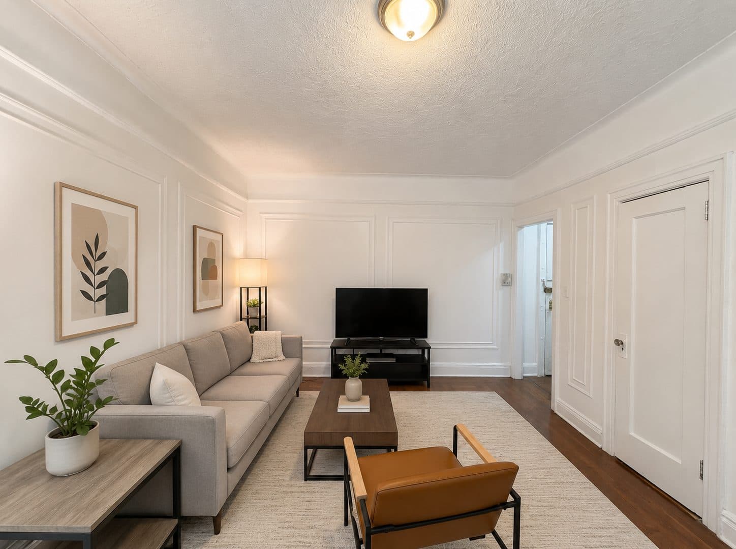 Living room with crown moldings, virtually staged