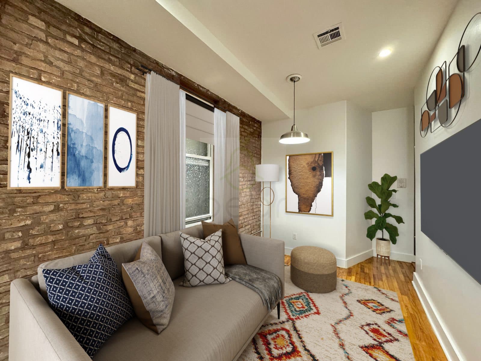 Living room with an exposed brick wall, virtually staged